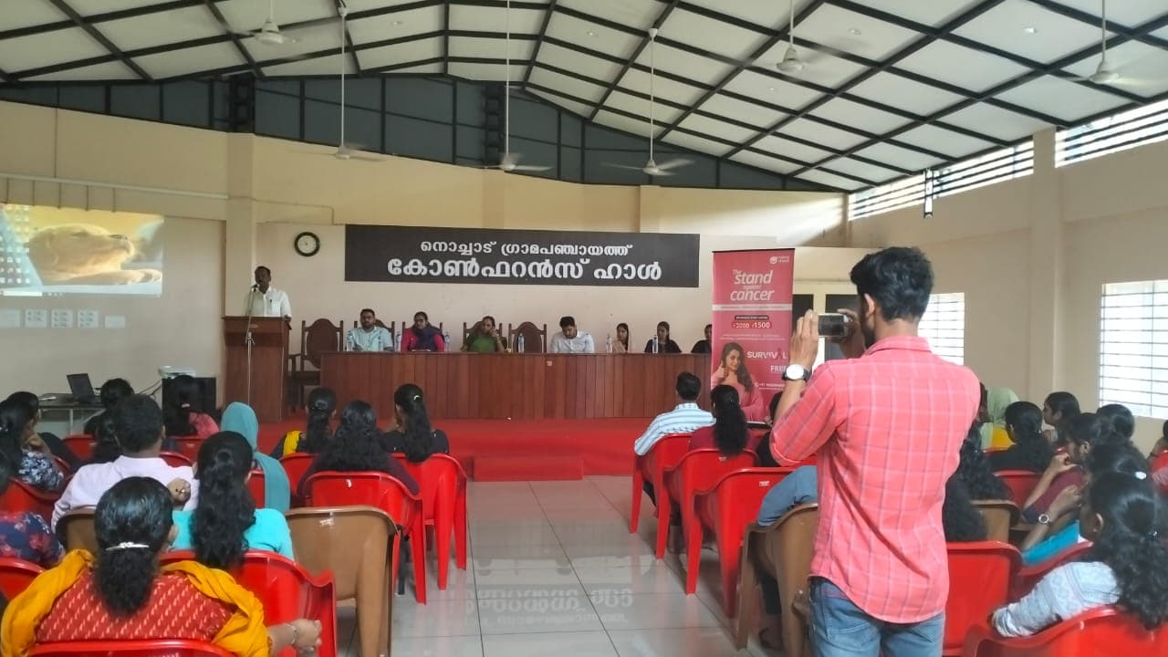 Audience gathering and campaign standee at Nochad Panchayath Conference Hall